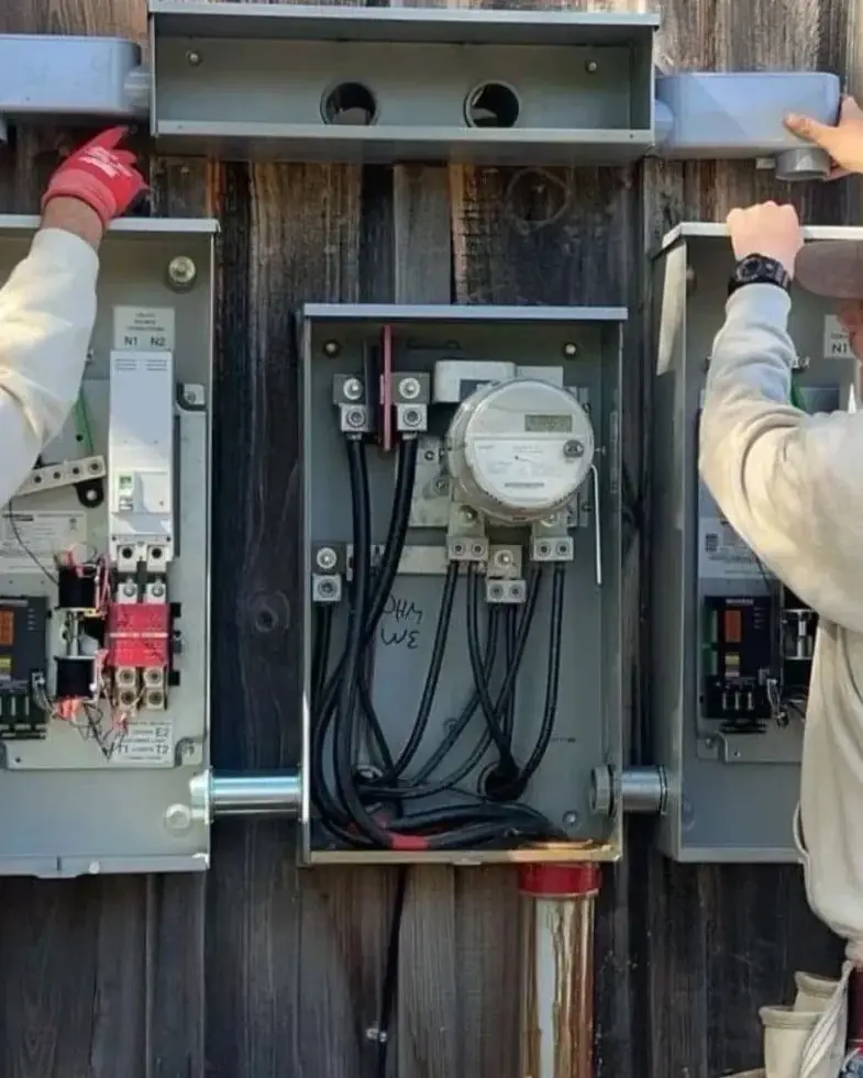 Paramount Electric crew working on meter bases